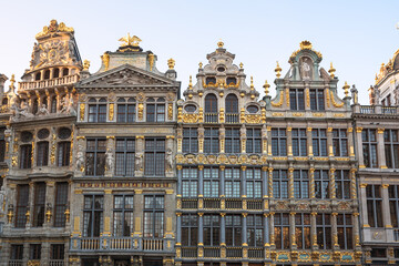 Fototapeta na wymiar View of the richly decorated facades of the historic guildhouses in Grand Place at Sunset. Brussels, Belgium.