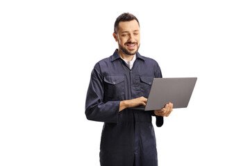 Auto mechanic working on a laptop computer