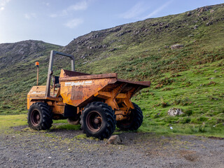 The historical yellow loader in a Scottish nature near Neist Point Lighthouse