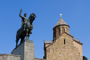 Fototapeta na wymiar Metekhi Church and the statue of King Vahtang Gorgasali, in Tbilisi, Georgia.