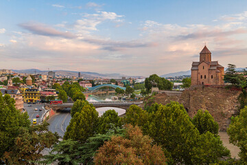 Fototapeta na wymiar View over the Metekhi Church and Peace Bridge over the River Kura, in Tbilisi, Georgia.