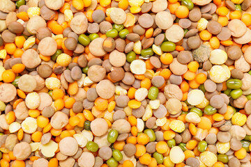 Different raw legumes as background