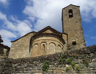 View of the semicircular apse and bell tower of the Romanesque Church of San Martin in the village...