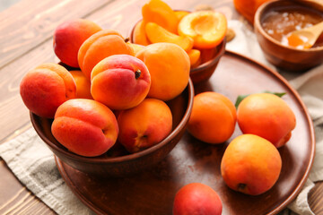 Tasty ripe apricots on table