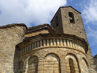 View of the semicircular apse and bell tower of the Romanesque Church of San Martin in the village...