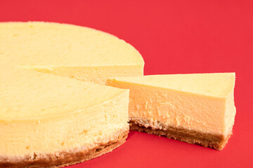 Sliced cheesecake close-up. Homemade creamy classic cheesecake