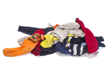 Pile of dirty multicolored socks isolated on a white background