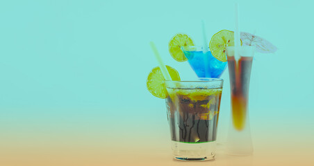 Three different colorful cocktails with lemon and ice cubes, refreshing alcoholic drinks