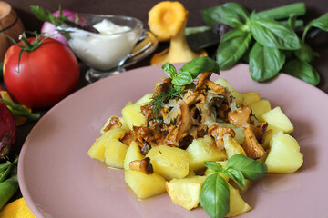 On the table hot dishes potatoes mushrooms and vegetables