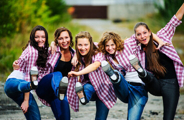 Group of yang European tap dancers perform outdoor