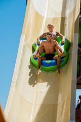 young couple having fun in water slides