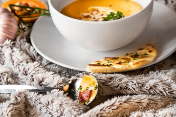 pumpkin soup with bacon bits and bread