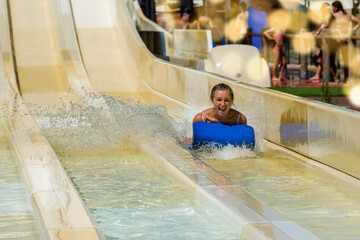 young woman having fun in water slides