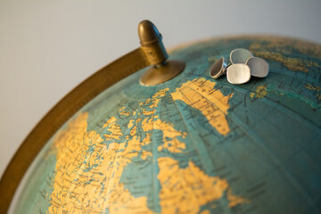 jewelry, shirt cufflinks on the world map