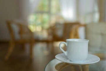 White Cup and rattan furniture on the summer porch.
