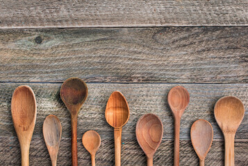old wooden spoons  on old wooden board