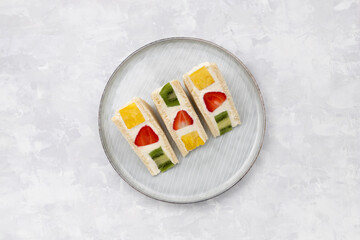 Japanese style sweet fruits sandwich with strawberry, pineapple and kiwi