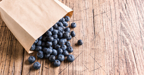 Fresh blueberries on a wooden background. Long banner