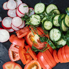 Background with sliced tomatoes, cucumbers, radishes and herbs