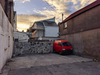 red van parked alone in the city 