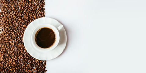 Top view of coffee cup on coffee bean texture and white background. Restaurant cafe shop creative menu.