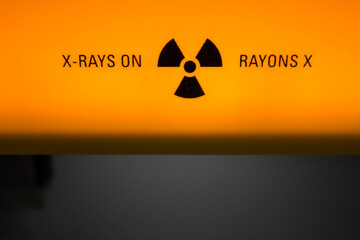 Orange and black x-ray warning sign in a science laboratory