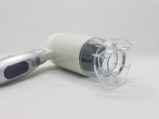 Woman Beauty and Fashion Device Accessories Hair Dryer in White Isolated background