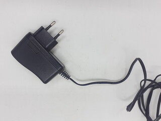 Portable AC to DC Electric Adapter Device in White Isolated Background 
