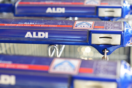Hamburg / Germany - October 1, 2017: Handle of a shopping cart with the logo of ALDI -  ALDI is a german global discount supermarket chain - Hamburg, Germany