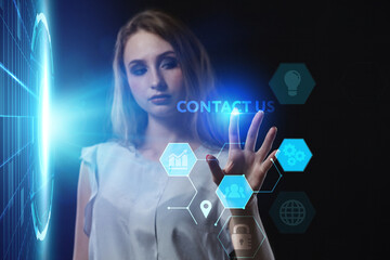 Business, Technology, Internet and network concept. Young businessman working on a virtual screen of the future and sees the inscription: Contact us