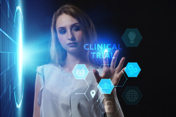 Business, Technology, Internet and network concept. Young businessman working on a virtual screen of the future and sees the inscription: Clinical trial