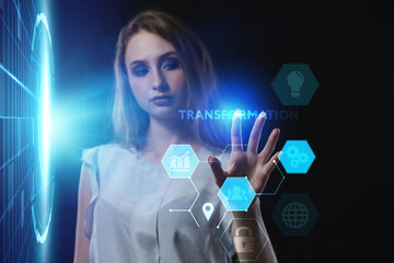 Business, Technology, Internet and network concept. Young businessman working on a virtual screen of the future and sees the inscription: Transformation