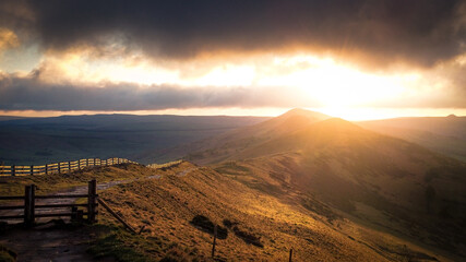 A dramatic arial view on Mam Tor in the Peak District during sunrise. 