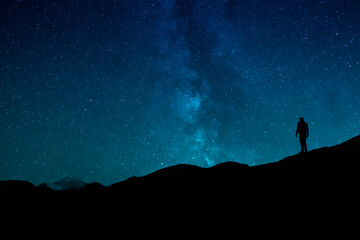 Obraz na płótnie Canvas Man Standing Under The Stars At Night