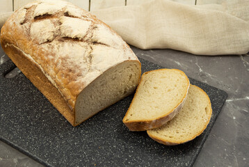 White bread made from wheat flour on wood background