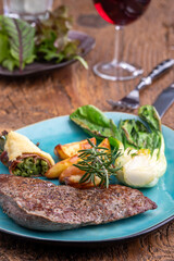 steak on a plate with vegetables
