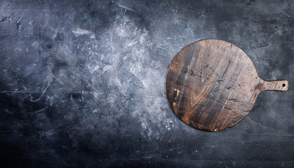 Pizza cutting board on dark background