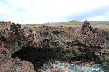 Fototapeta na wymiar Volcanic coastal landscape at Ana Kakenga on Easter Island, Rapa Nui, Polynesia, Chile, South America 