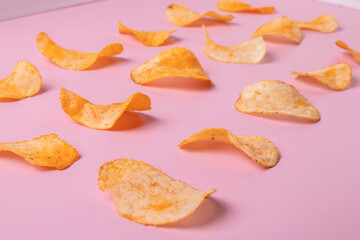 golden cruchy crisps on pink