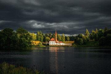 Fototapeta na wymiar Beautiful summer cloudy landscape with a Priory Palace in Gatchina. Russia