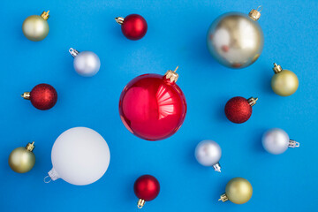 Christmas composition with colorful  balls on the blue background. Top view. Closeup.