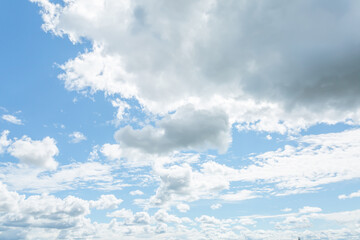 White clouds in the blue sky. Horizontal image.