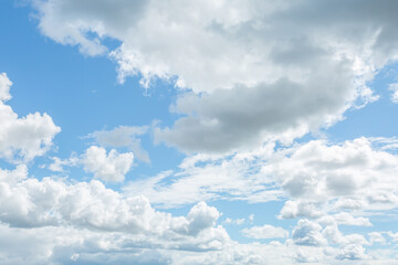 Cumulonimbus clouds in the blue sky. Vertical image.