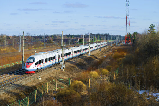 LENINGRAD REGION, RUSSIA - APRIL 10, 2018: Passing high-speed train EVS2-02 "Sapsan" on an April day