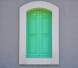   Colorful abstract painted window shutter architectural detail on the Cabo Rojo, Puerto Rico lighthouse   