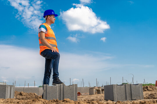 security engineer on the construction of the foundament of the house. copy space