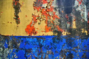  Weathered painted wall with colorful peeling textured paint in Rincon, Puerto Rico  