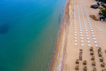 Aerial view of the beach with umbrellas. Sea beach coastline, summer holiday.