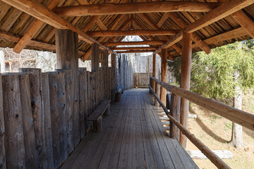 Fototapeta na wymiar Wooden fort, modern built as attraction. Inner passage.