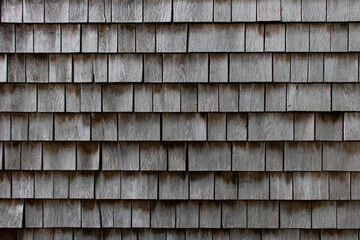 wooden siding shingles on a cape cod home